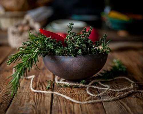 Traditional Romanian vegetable soup in a rustic bowl