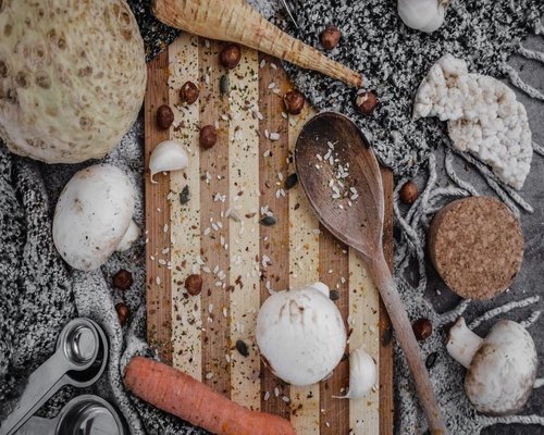 Different healthy ingredients arranged on a wooden board highlighting natural food