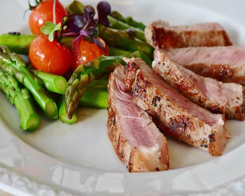 Overhead view of a balanced plate with grains, vegetables and protein source